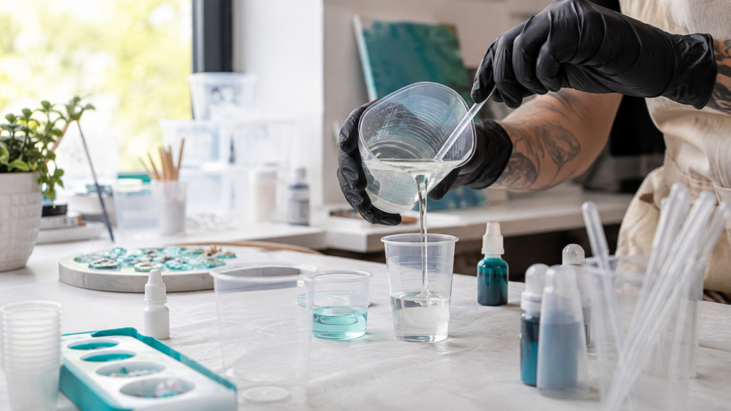 Resin mixing and measuring tools including disposable cups and graduated pipettes